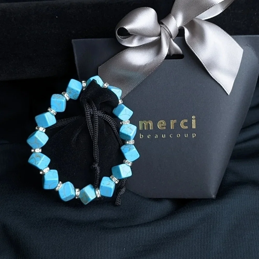 Pretty faux turquoise color beaded bracelet with CZ accents, cube shape beads